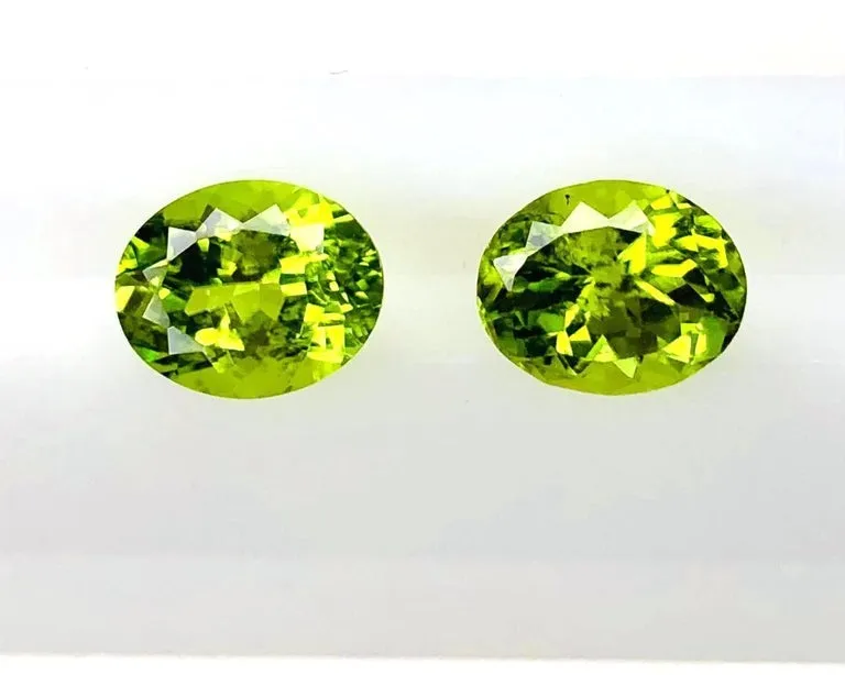 6.02 Carats Total, Pair of Apple Green Oval Peridots