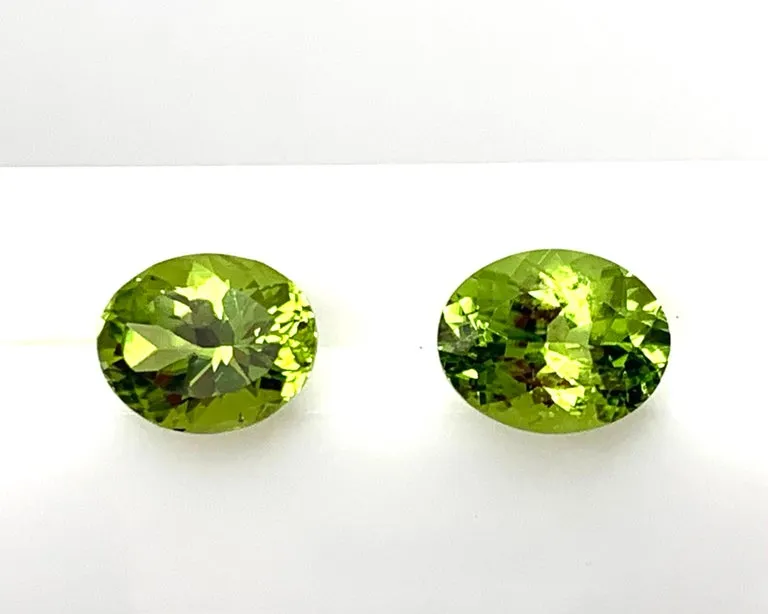6.02 Carats Total, Pair of Apple Green Oval Peridots