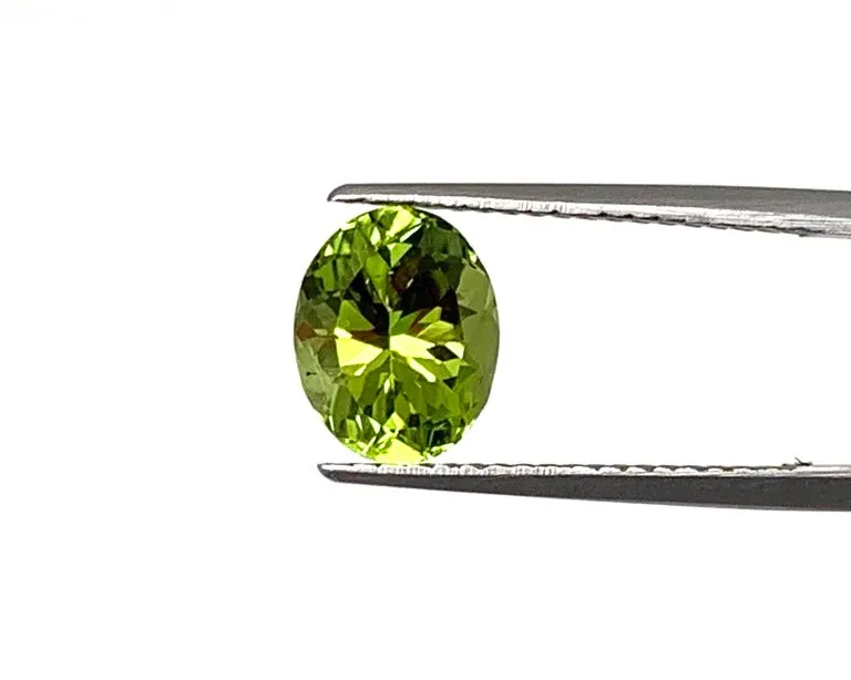 6.02 Carats Total, Pair of Apple Green Oval Peridots